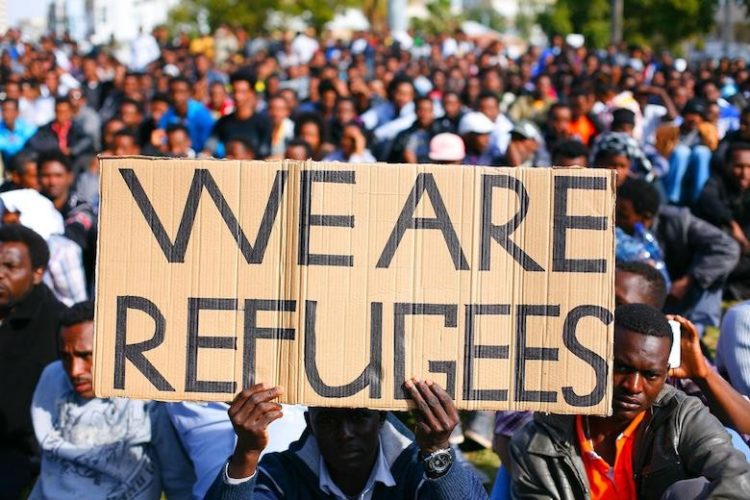Rifugiati contro migranti